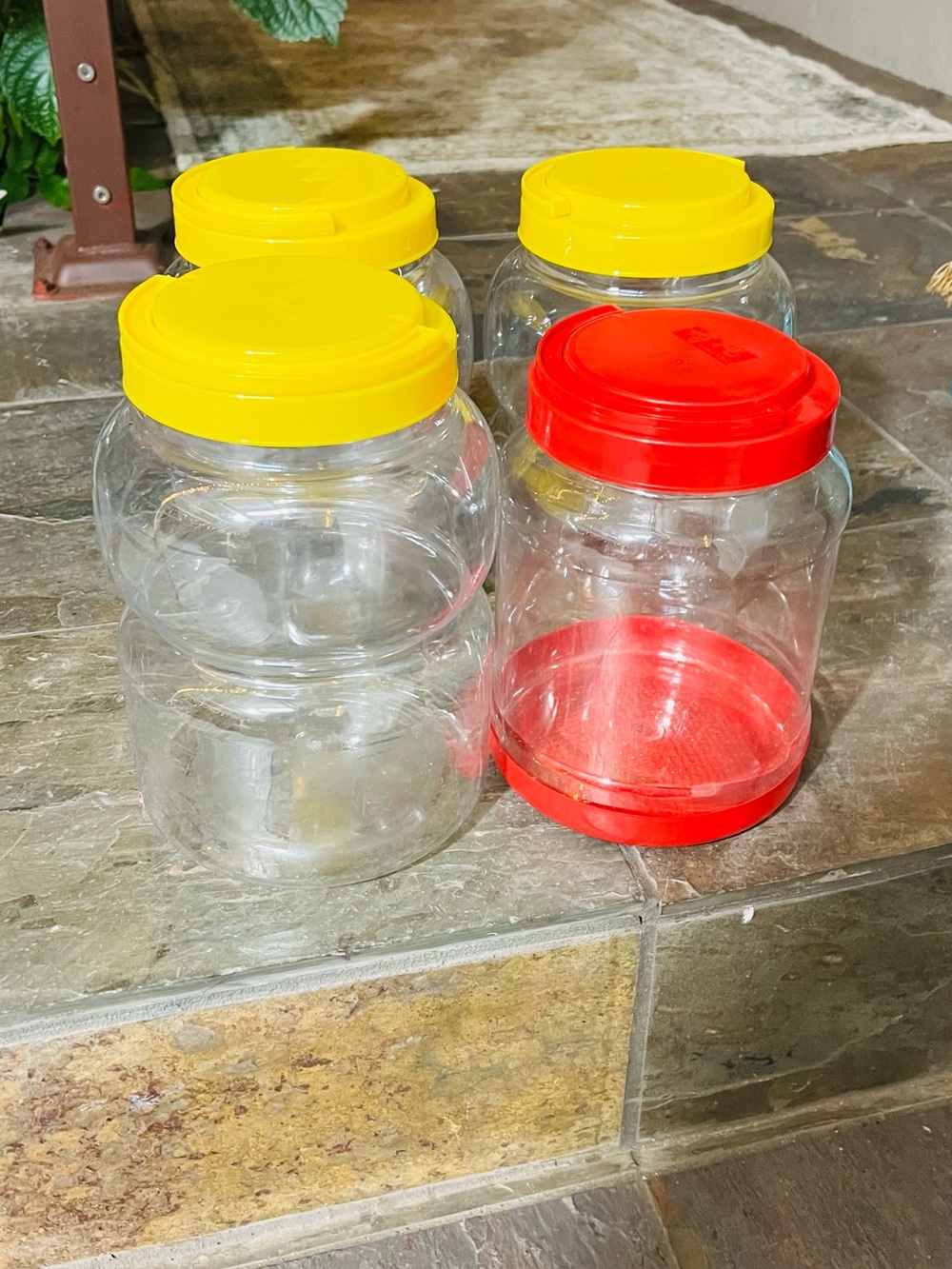 Set of  4 Clear Plastic Jars with Yellow and Red Lids